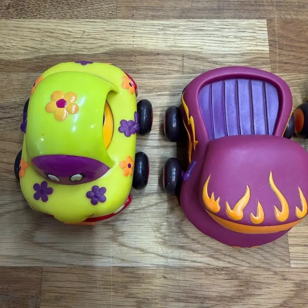 B. Toys Pull Back Trucks Taxi Cab Convertible Lot of 4 Flower Car Play Imaginati